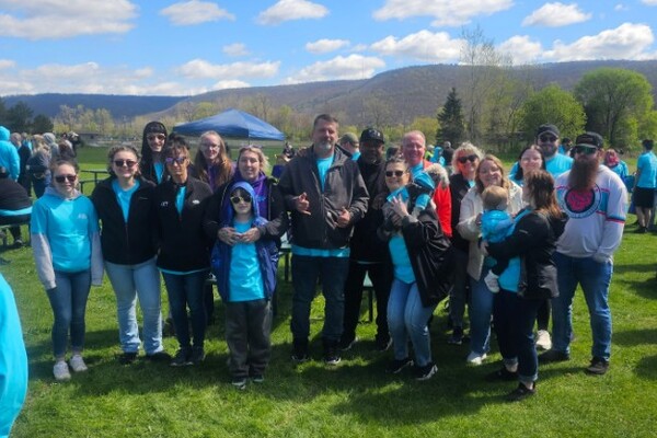 Employees step up for Walk a Mile in My Shoes event