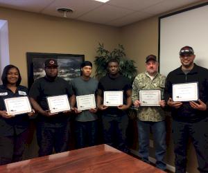 Pictured: Paige Nelson, Demarcus McKinney, Preston Baker, Jermaine Taylor, Ryan White and Eugene Jones (not pictured: William Gilbert)